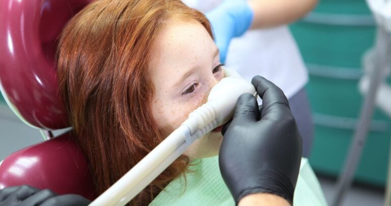 A child receiving sedation during a dental visit.